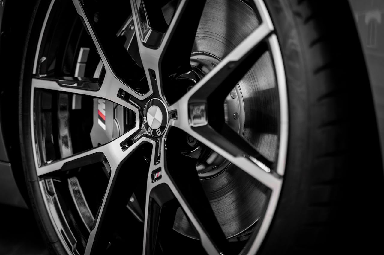 services-01 Detailed close-up of a BMW alloy wheel showcasing its sleek design and emblem.